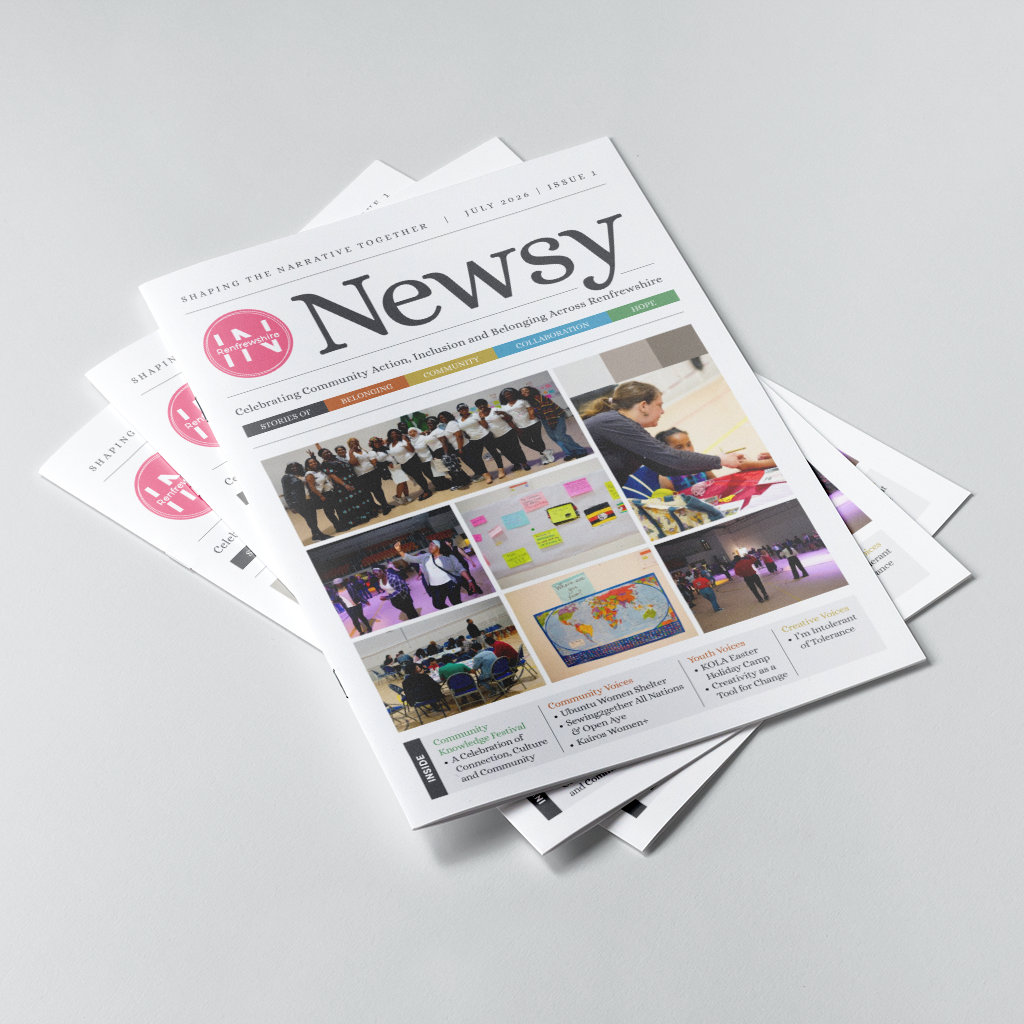 A stack of printed magazines or brochures fanned out on a light gray studio background. The top magazine is angled to show its front cover, with the title 'Newsy' prominently visible and several smaller article photos and text blocks on the cover.