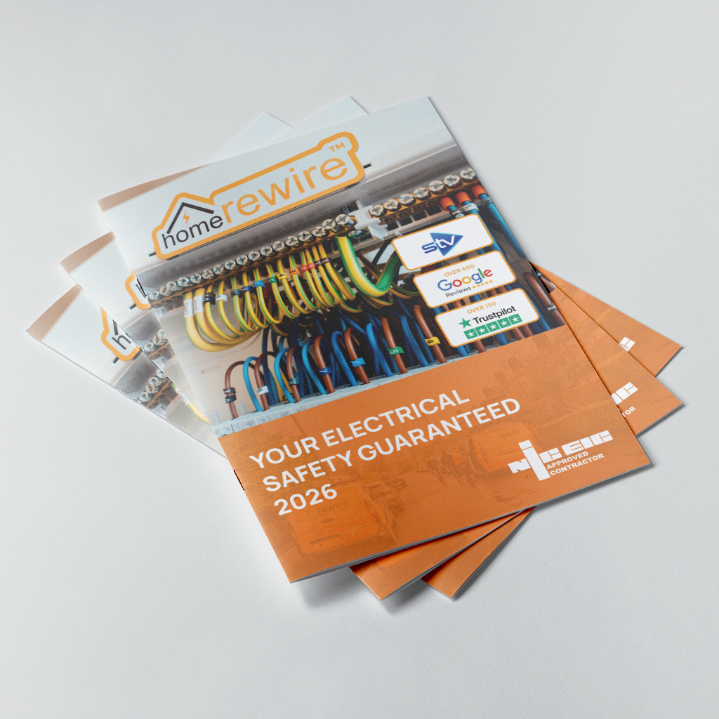 A stack of printed promotional brochures for HomeWire electrical safety, photographed on a light gray studio background. 