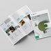 An open printed Pefect Bound Brochure laid on a light grey background. The brochures have a white base with teal typography, small embedded photos, and a large olive-green circular graphic on the closed cover.