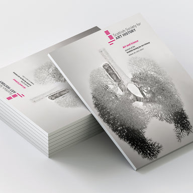 A stack of printed Pefect Bound Brochures on a light grey studio background, with one brochure standing upright to show the cover. The cover has a monochrome artistic illustration and visible text including 'Scopio Society for Art History' and 'Art and Science.