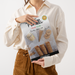 Woman holding Ice Cream Company printed saddle stitched brochure